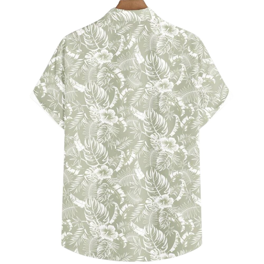 Vista traseira da Camisa Vinser Alvorada, com estampa tropical em folhas e flores brancas sobre fundo verde-sálvia, manga curta, tecido leve e acabamento premium.