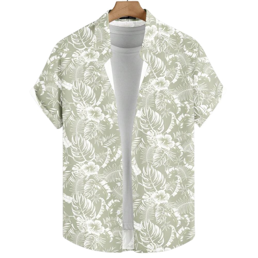 Vista frontal da Camisa Vinser Alvorada, com estampa tropical em folhas e flores brancas sobre fundo verde-sálvia, manga curta, tecido leve e acabamento premium.