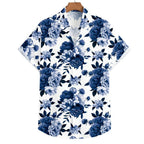 Vista frontal da Camisa Vinser Azul Imperial, com estampa floral em tons de azul sobre fundo branco, destacando a modelagem de manga curta, o caimento leve e o acabamento premium da peça.