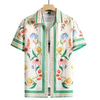 Camisa masculina Vinser Copacabana branca com estampa floral colorida, manga curta e acabamento premium