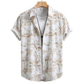 Vista frontal da Camisa Vinser Costa, com estampa tropical em tons de branco e bege, manga curta, modelagem leve e caimento confortável para um visual elegante e descontraído.