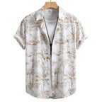 Vista frontal da Camisa Vinser Costa, com estampa tropical em tons de branco e bege, manga curta, modelagem leve e caimento confortável para um visual elegante e descontraído.