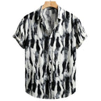 Vista frontal da Camisa Vinser Costa Noturna, com estampa abstrata em preto, branco e cinza inspirada no movimento das ondas, modelagem de manga curta e tecido leve para uso casual.