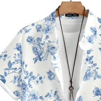 Detalhe da gola da camisa masculina Vinser branca com estampa floral azul, destacando o acabamento da gola, a abertura frontal e o padrão floral sofisticado.