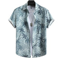 Vista frontal da Camisa Vinser Horizonte Azul, com estampa tropical de coqueiros em tons de azul acinzentado, modelagem de manga curta e tecido leve para um visual sofisticado e refrescante.