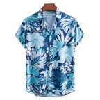 Vista frontal da Camisa Vinser Litoral Azul com estampa tropical de folhas e flores em tons de azul, azul-marinho e branco, modelagem de manga curta e gola colarinho.