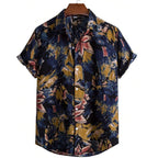 Camisa masculina Vinser Paraty azul-marinho com estampa tropical abstrata em tons de azul, mostarda e rosa, manga curta, gola tradicional e fechamento frontal por botões.