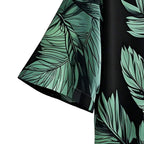 Detalhe da manga da Camisa Vinser Selva Costeira, destacando o acabamento da costura, a modelagem e a estampa tropical de folhas verdes sobre fundo preto.
