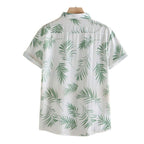 Costas da Camisa Vinser Seychelles branca com estampa tropical de folhas verdes e manga curta